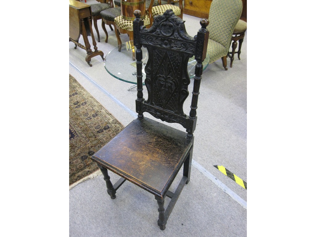 Appraisal: Carved oak hall chair with mask to splat