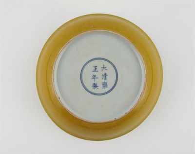 Appraisal: A Chinese Imperial yellow-glazed saucer dish with flared sides and