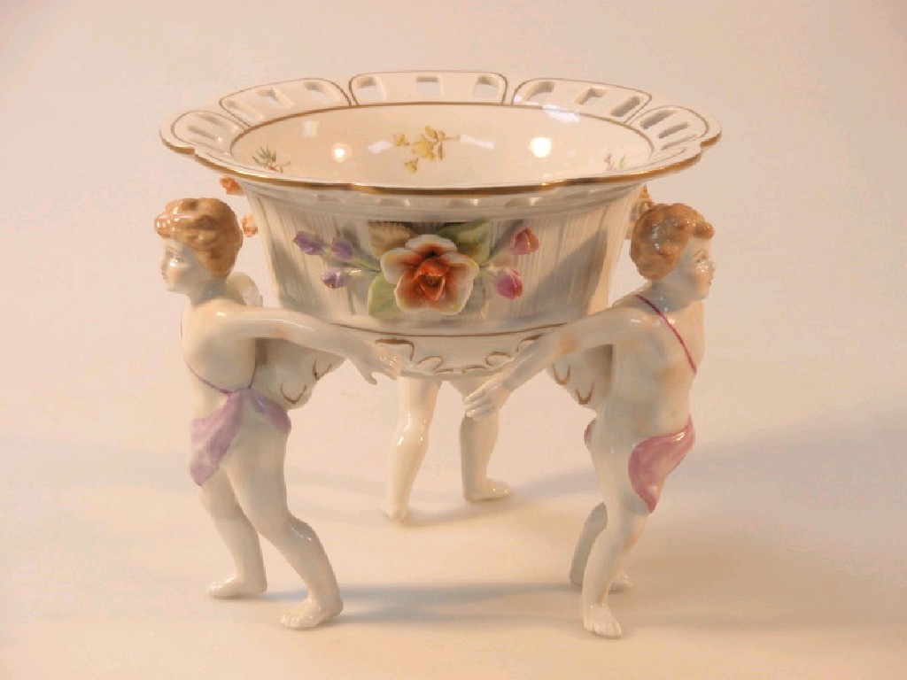 Appraisal: A Dresden porcelain pedestal bowl with cherub support cm high