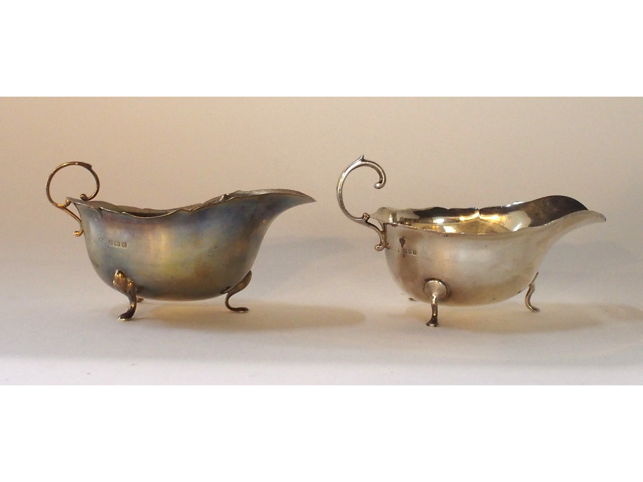 Appraisal: A lot comprising two silver sauceboats one by Asprey Co