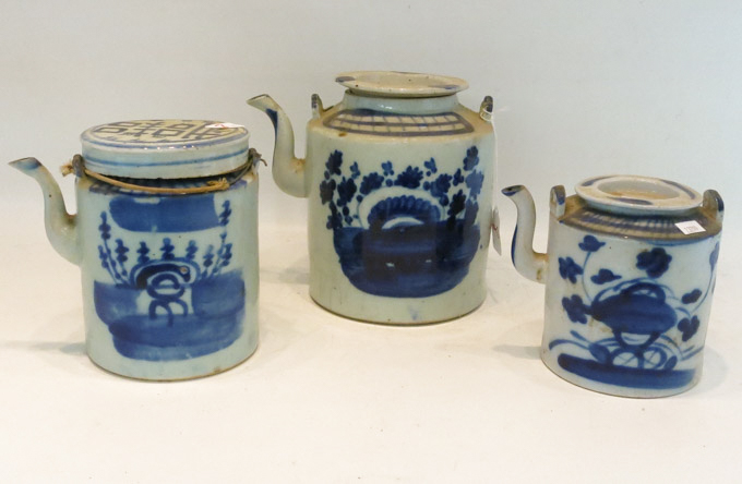 Appraisal: THREE BLUE AND WHITE CHINESE PORCELAIN TEAPOTS hand painted underglaze