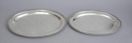 Appraisal: PAIR OF ENGLISH ARMORIAL SILVER GRADUATED PLATTERS Marked AP FP