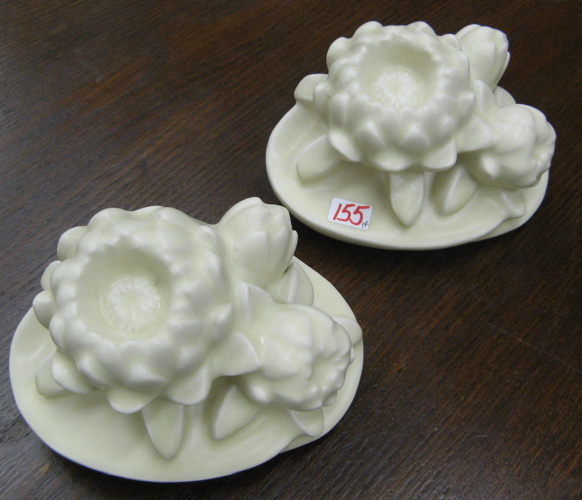 Appraisal: PAIR AMERICAN ROOKWOOD POTTERY BOOKENDS Water lilies off-white matt glaze