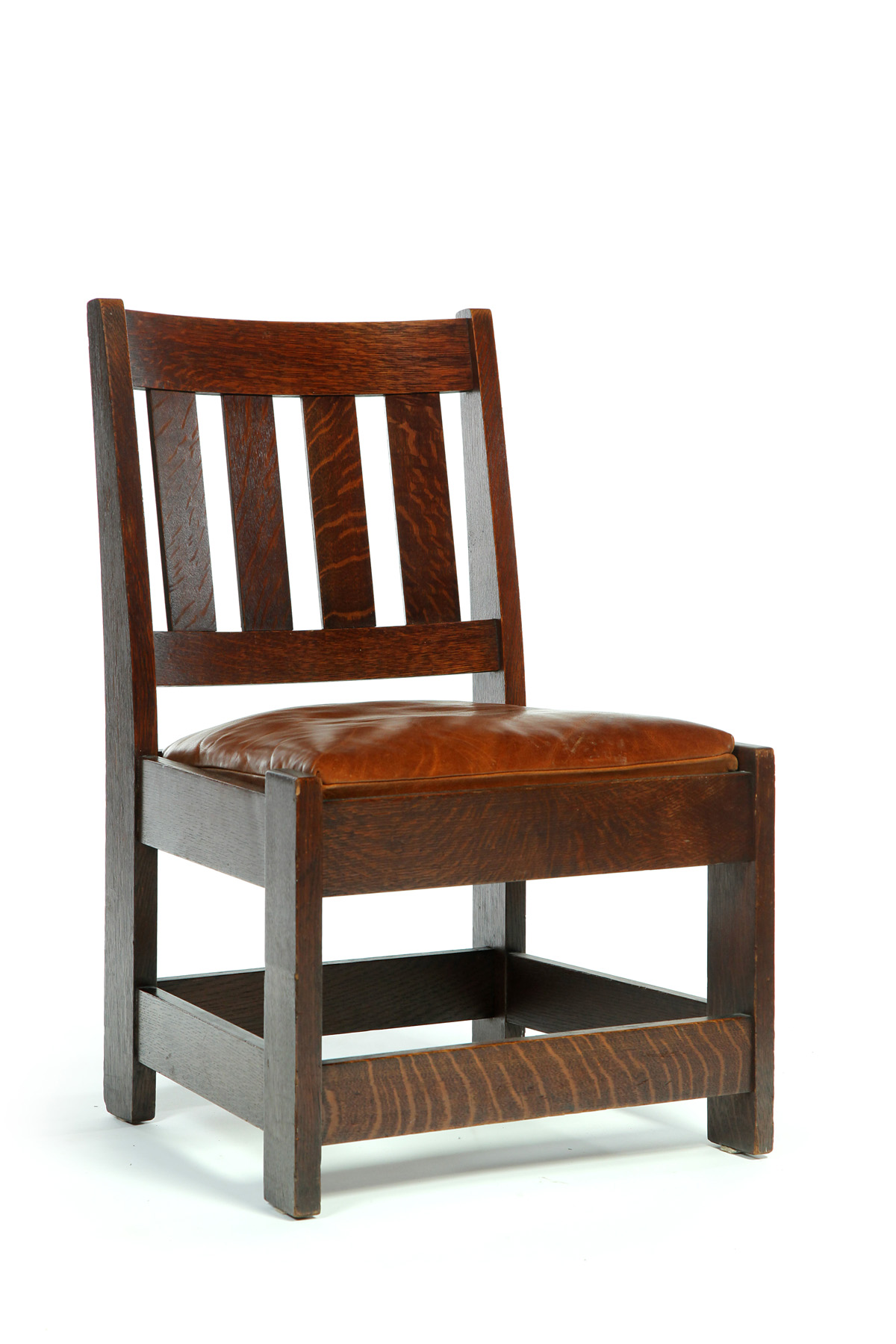 Appraisal: LIMBERT SLIPPER CHAIR Early th century oak slat back leather