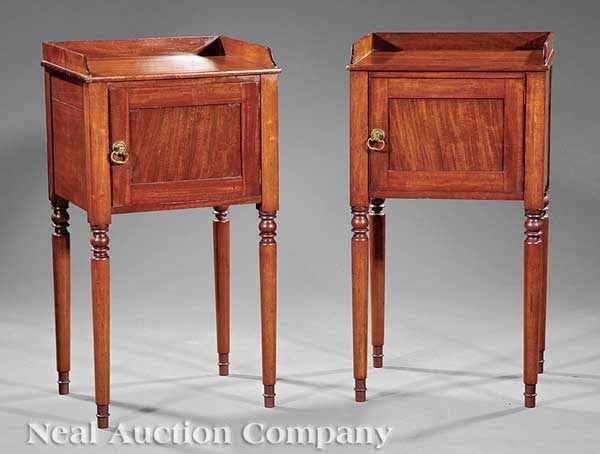 Appraisal: A Pair of Edwardian Carved Mahogany Washstands each with galleried