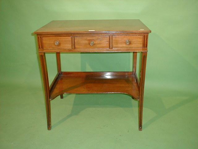 Appraisal: A Regency mahogany side table with three frieze drawers sabre