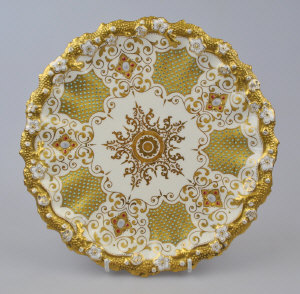 Appraisal: A Victorian Coalport gilded and 'jewelled' cabinet plate with naturalistic