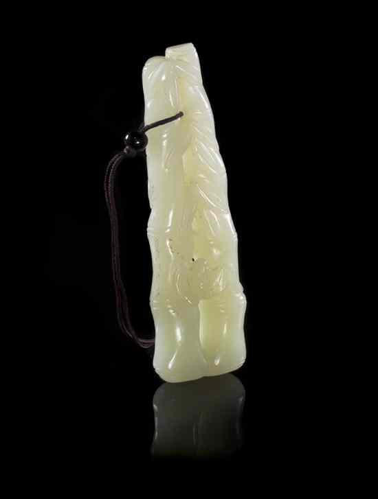 Appraisal: A Carved Jade Toggle of bamboo form depicting two segments