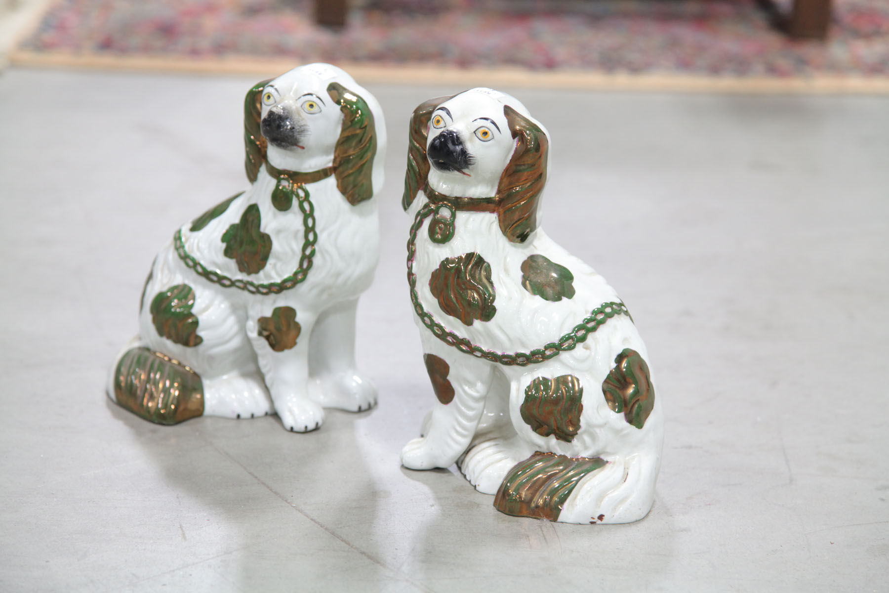 Appraisal: PAIR OF STAFFORDSHIRE DOGS English late th century Seated dogs