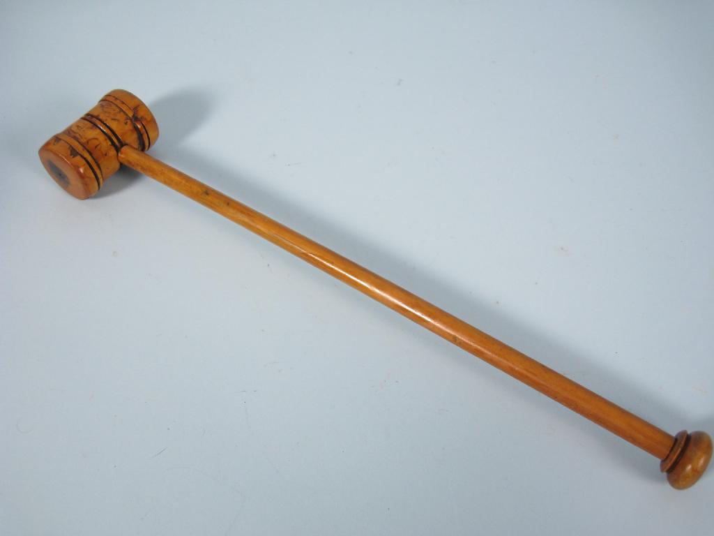 Appraisal: A turned cherry wood Gavel in