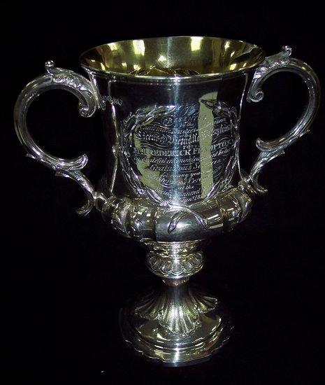 Appraisal: A Victorian two-handled prize cup with C scroll handles inscribed