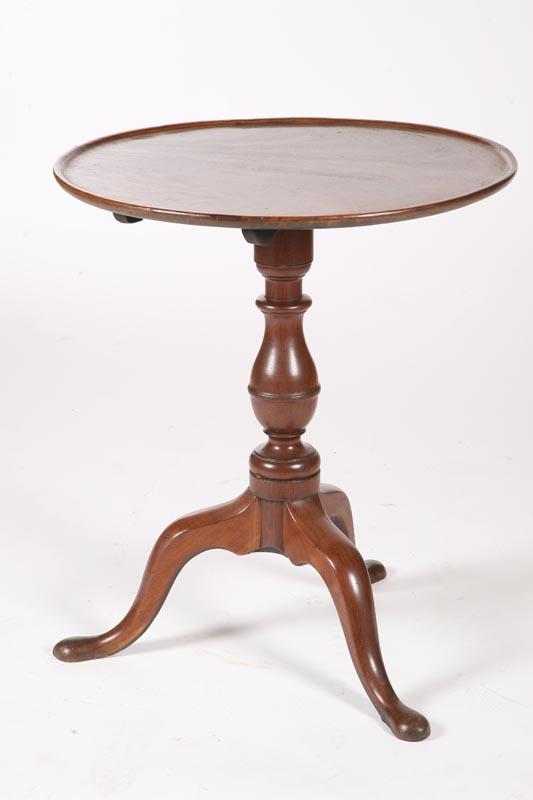 Appraisal: CHIPPENDALE TILT-TOP CANDLESTAND American late th century mahogany One-board dished