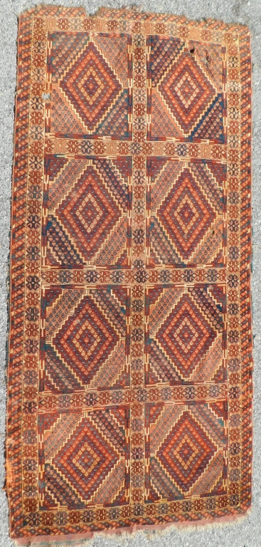 Appraisal: TURKMEN FLORAL RUG Turkey th CenturyNavy blue orange rust and