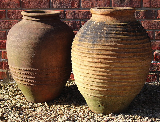 Appraisal: A GREEK TERRACOTTA RIBBED OVOID PITHOI TYPE JAR or planter