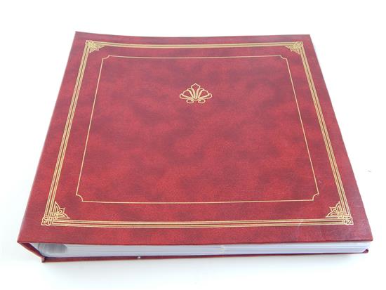 Appraisal: Large red album containing approximately early postcards most dated from