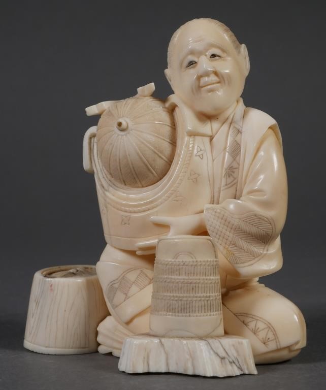 Appraisal: Japanese carved okimono of seated man holding a samurai warrior's