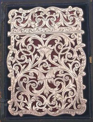 Appraisal: A Victorian card case with engraved fretwork scrolls and a