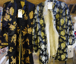 Appraisal: Oriental black silk robe with overall gold metallic embroidery of