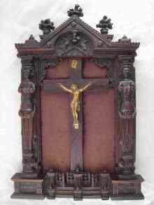 Appraisal: A framed French crucifix the rosewood cross and gilt metal