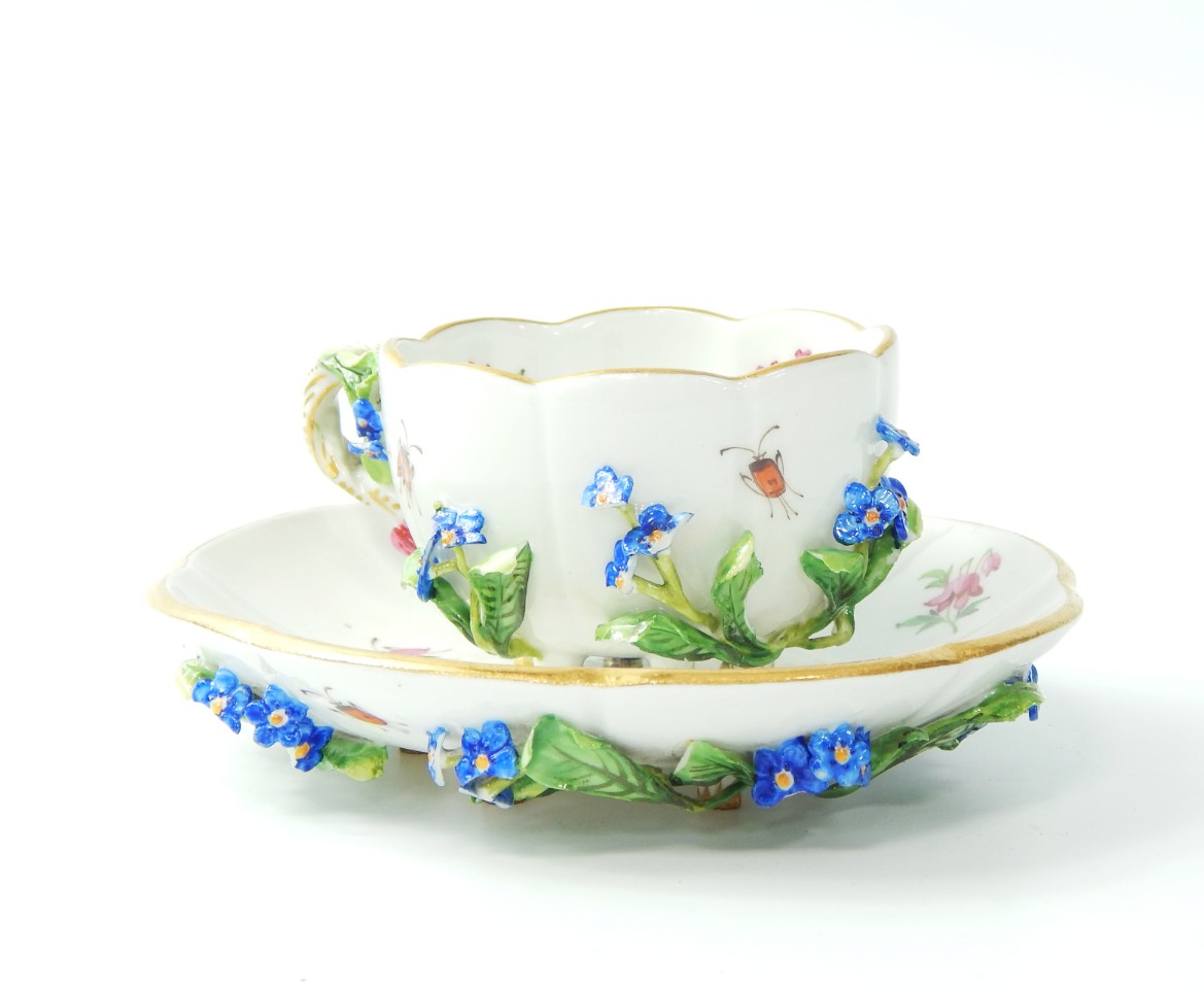 Appraisal: A Meissen porcelain cabinet cup and saucer encrusted with flowers