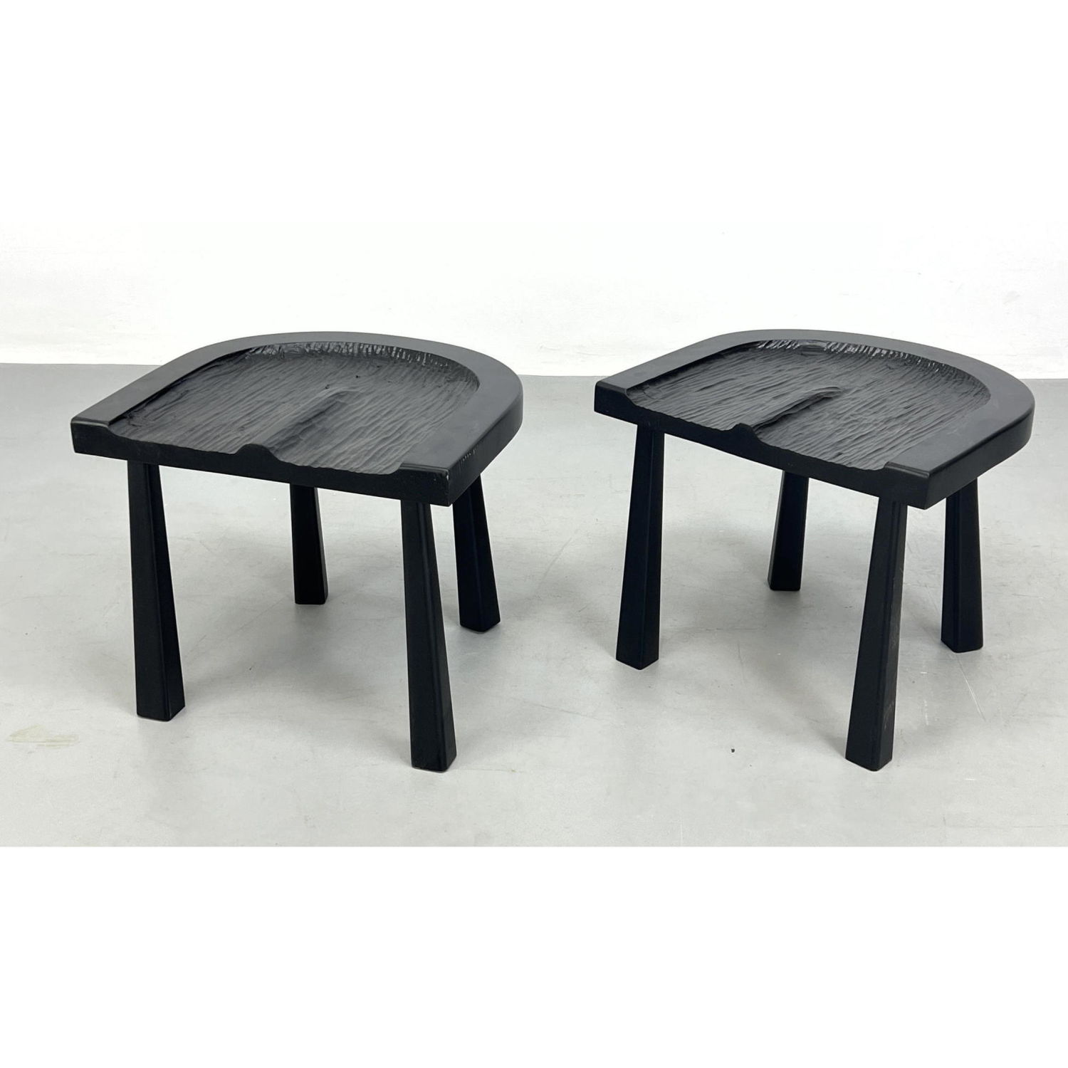 Appraisal: Pair Modernist Carved Seat Low Stools Ebonized Dimensions H inches