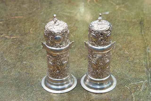 Appraisal: A PAIR OF VICTORIAN SILVER LIGHT HOUSE PEPPER CASTORS with