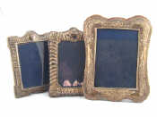 Appraisal: Three silver photo frames two strut backed crested frames with