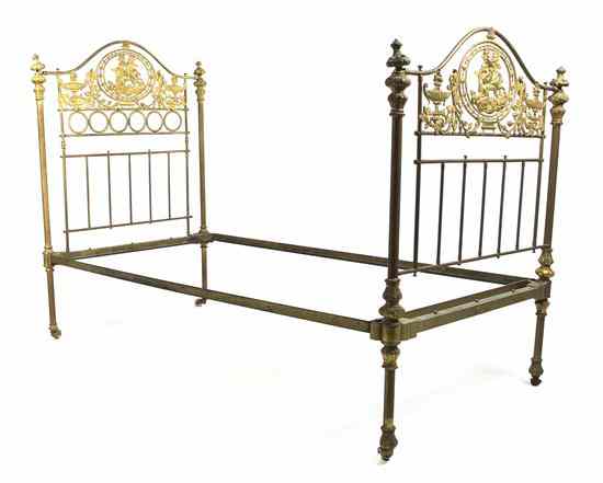 Appraisal: A Victorian Gilt Metal Twin Bed with conforming head and