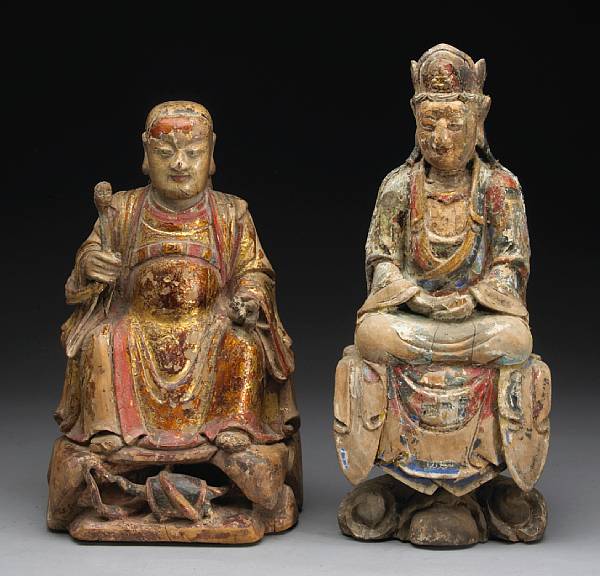 Appraisal: Two polychrome and gilt-painted carved wood deities Qing Dynasty th