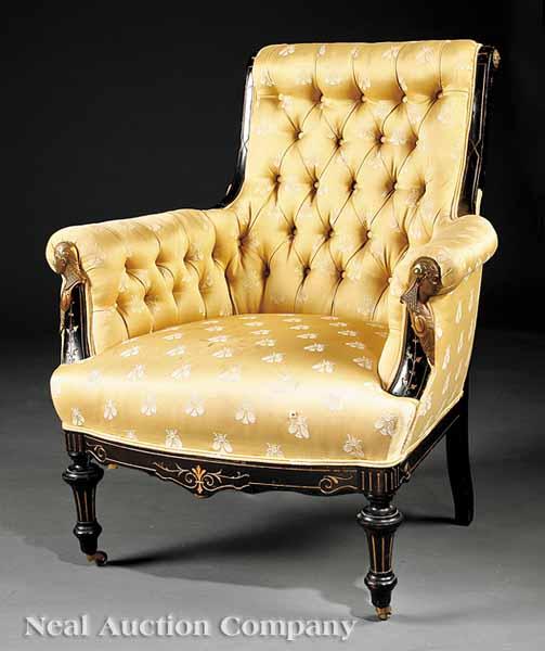 Appraisal: An Egyptian Revival Bronze-Mounted Ebonized and Gilt-Incised Sofa and Armchair