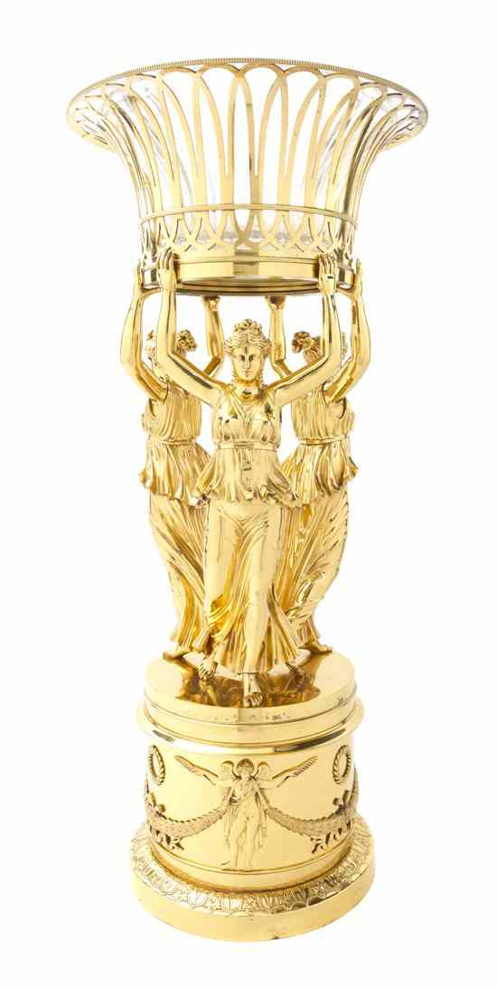 Appraisal: An Empire Style Gilt Bronze Figural Centerpiece having a reticulated