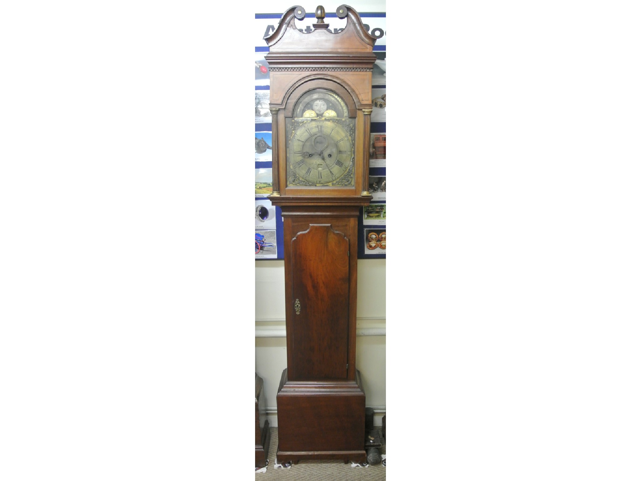 Appraisal: A Georgian mahogany longcase clock the hood with reeded column