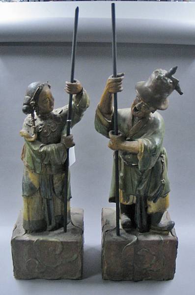 Appraisal: A pair of polychrome glazed pottery figures Circa The male