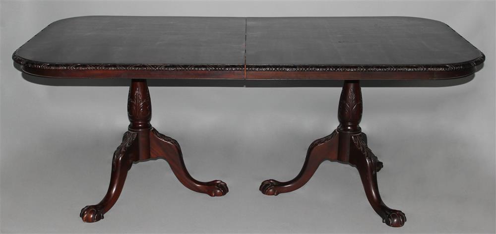 Appraisal: CARVED CHIPPENDALE STYLE MAHOGANY DOUBLE PEDESTAL DINING TABLE having a