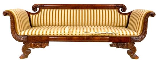 Appraisal: Empire rolled arm sofa mahogany mahogany veneer elaborate carving and