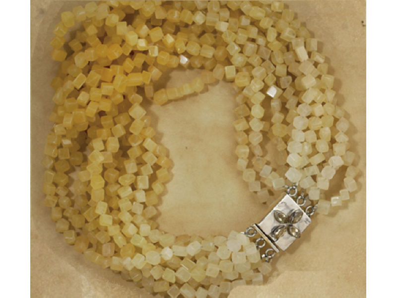 Appraisal: LEMON QUARTZ BEADS Twelve strand necklace with cube cut faceted