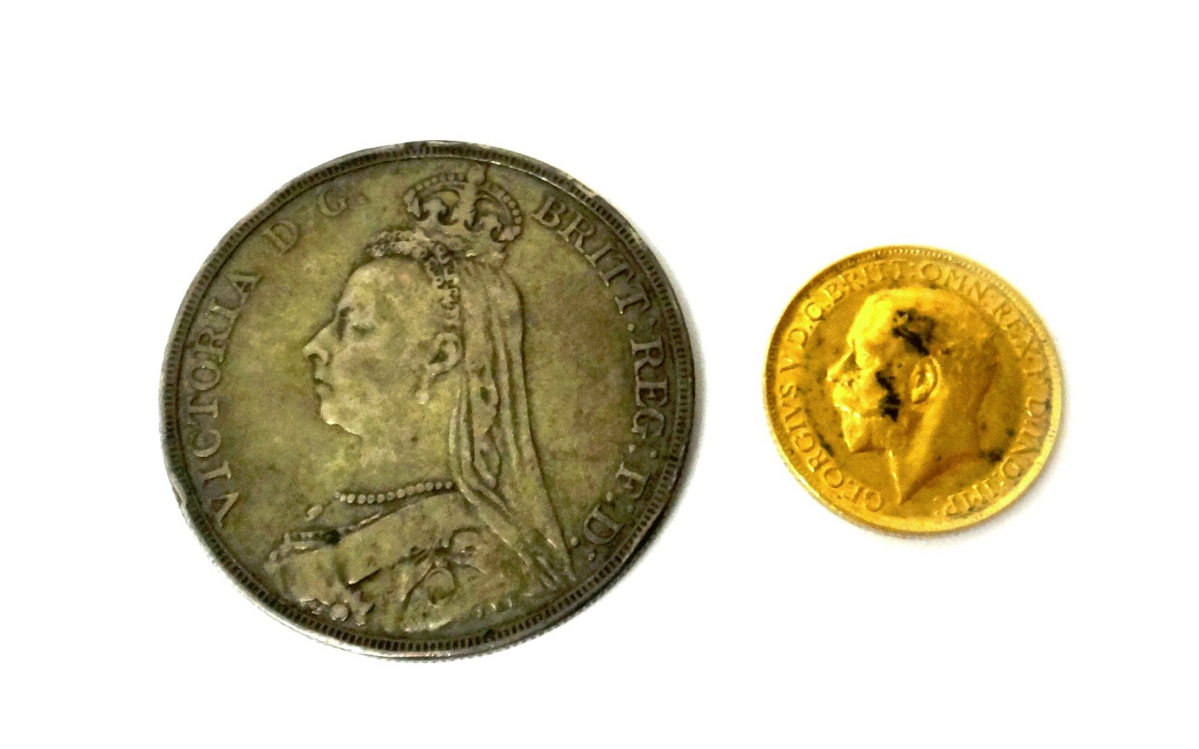 Appraisal: A George V sovereign and a Victoria Jubilee head crown