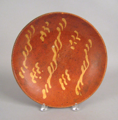 Appraisal: Redware charger th c with yellow slip decoration dia