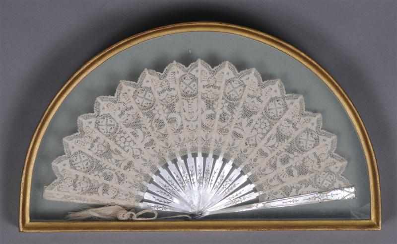 Appraisal: LACE FAN WITH SILVER HIGHLIGHTED MOTHER-OF-PEARL STICKS Contained in shadowbox