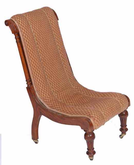 Appraisal: A LATE VICTORIAN MAHOGANY AND UPHOLSTERED NURSING CHAIR the back