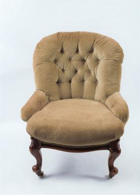 Appraisal: A Victorian deep buttoned back chair on moulded cabriole legs