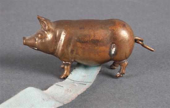 Appraisal: Brass pig figural sewing tape early th century measuring tape