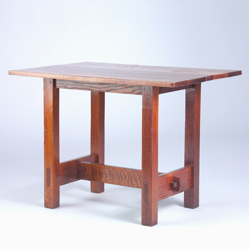 Appraisal: GUSTAV STICKLEY Lunch table no with an up-ended stretcher mortised