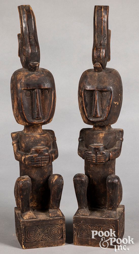 Appraisal: Timor carved seated guardian spirit figures Pair of Timor carved