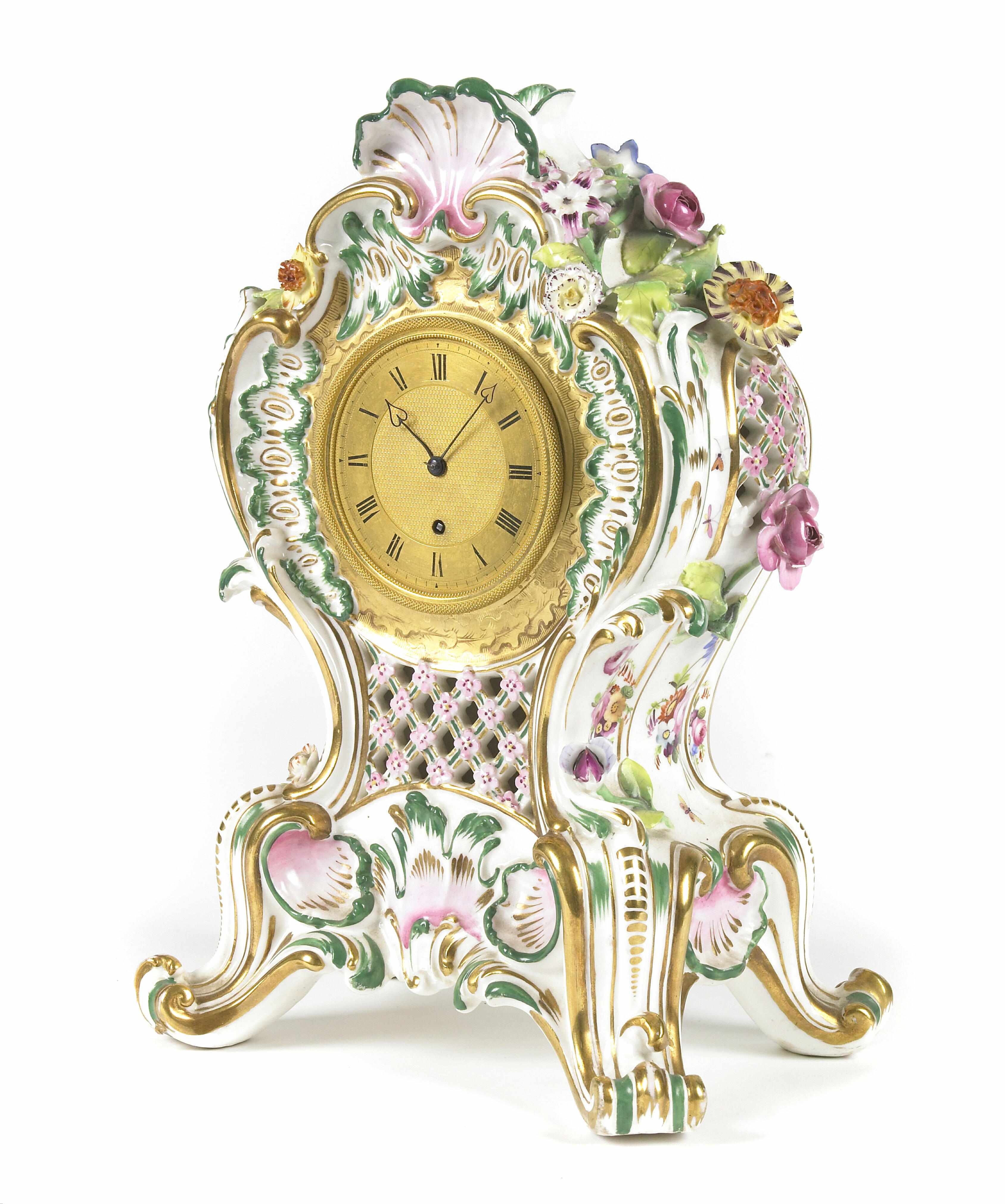 Appraisal: A Continental Rococo style paint decorated porcelain mantel clock height