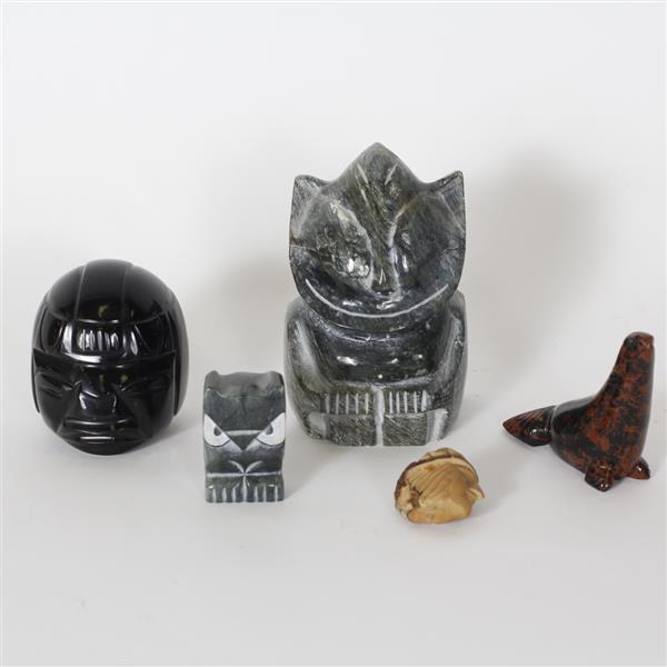 Appraisal: Five piece Inuit soapstone and polished stone biliken carving by