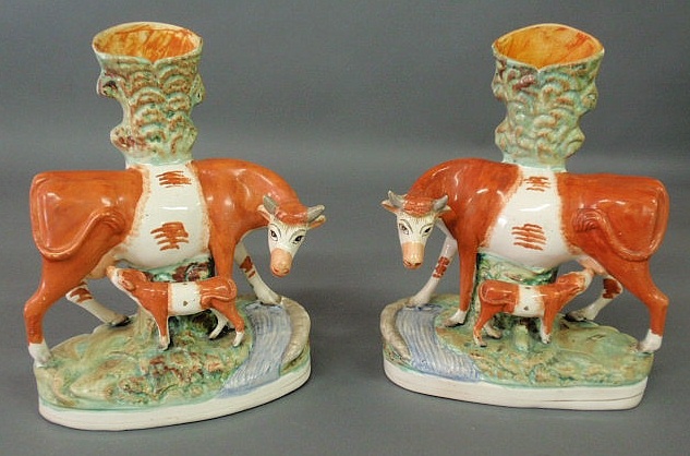 Appraisal: Pair of English Staffordshire cow and calf spill vases c