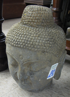 Appraisal: GRANITE SCULPTED HEAD OF BUDDHA with elongated ear lobes down