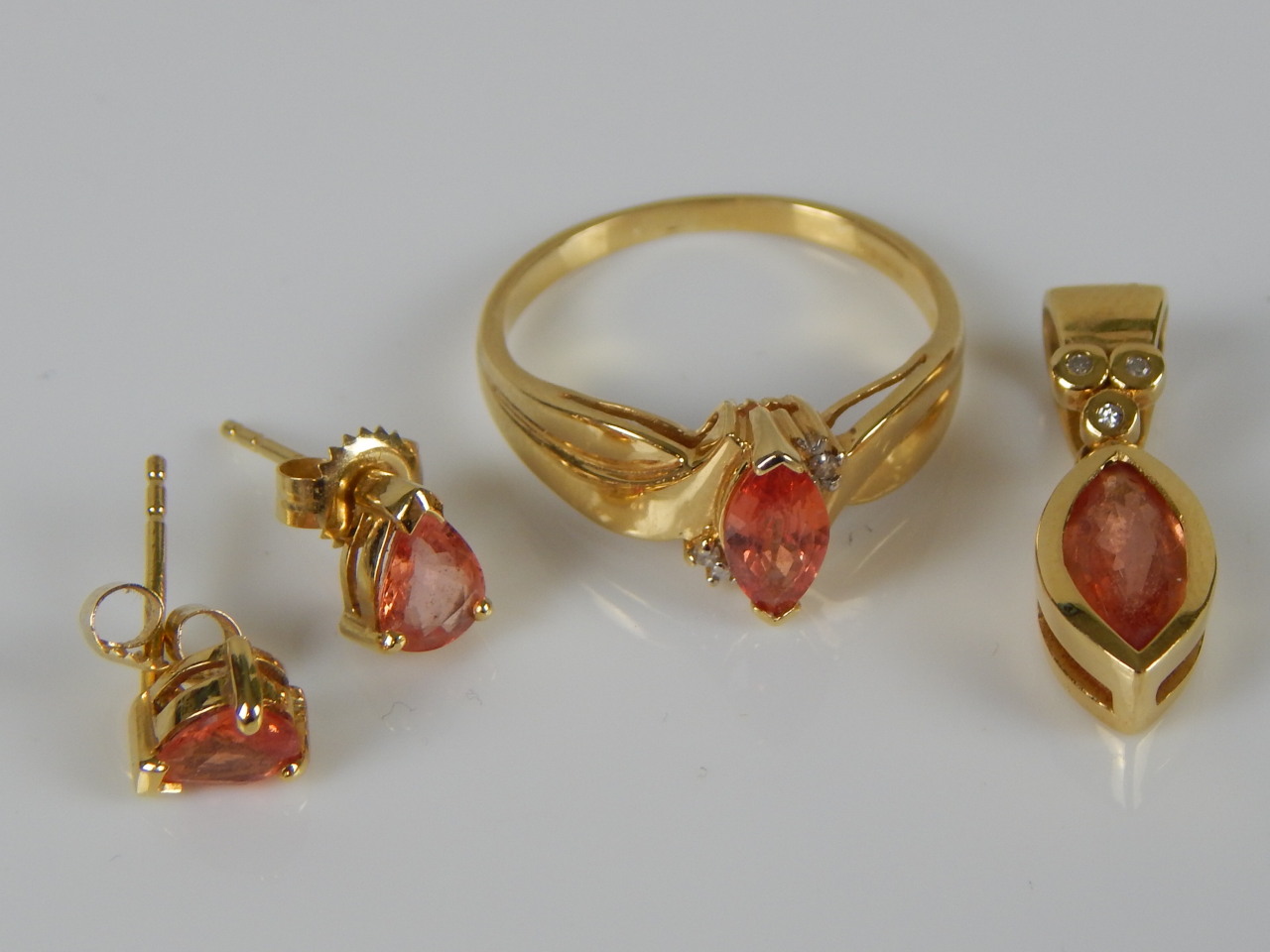 Appraisal: A jewellery set comprising earrings pendant and ring with Padparadscha