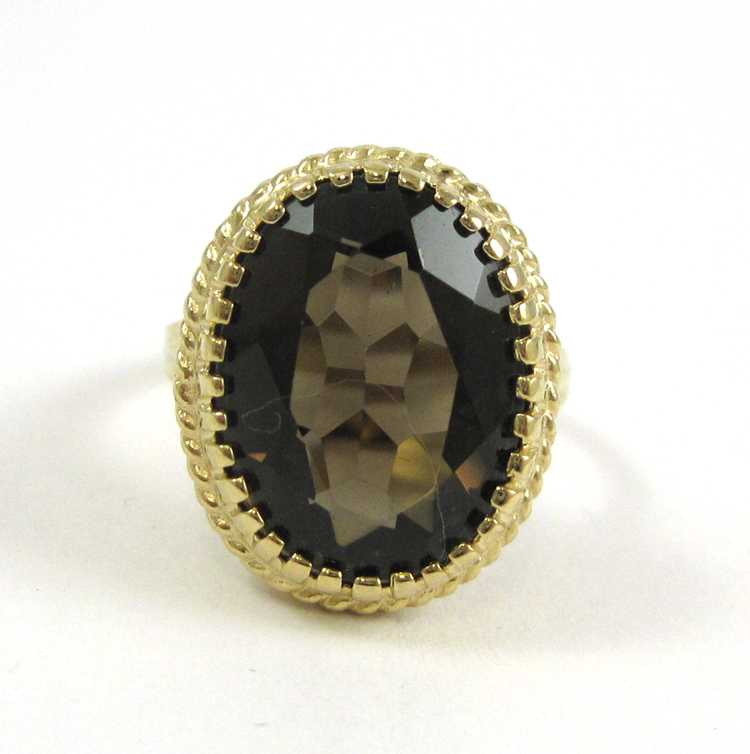 Appraisal: SMOKY QUARTZ AND TEN KARAT YELLOW GOLD RING set with